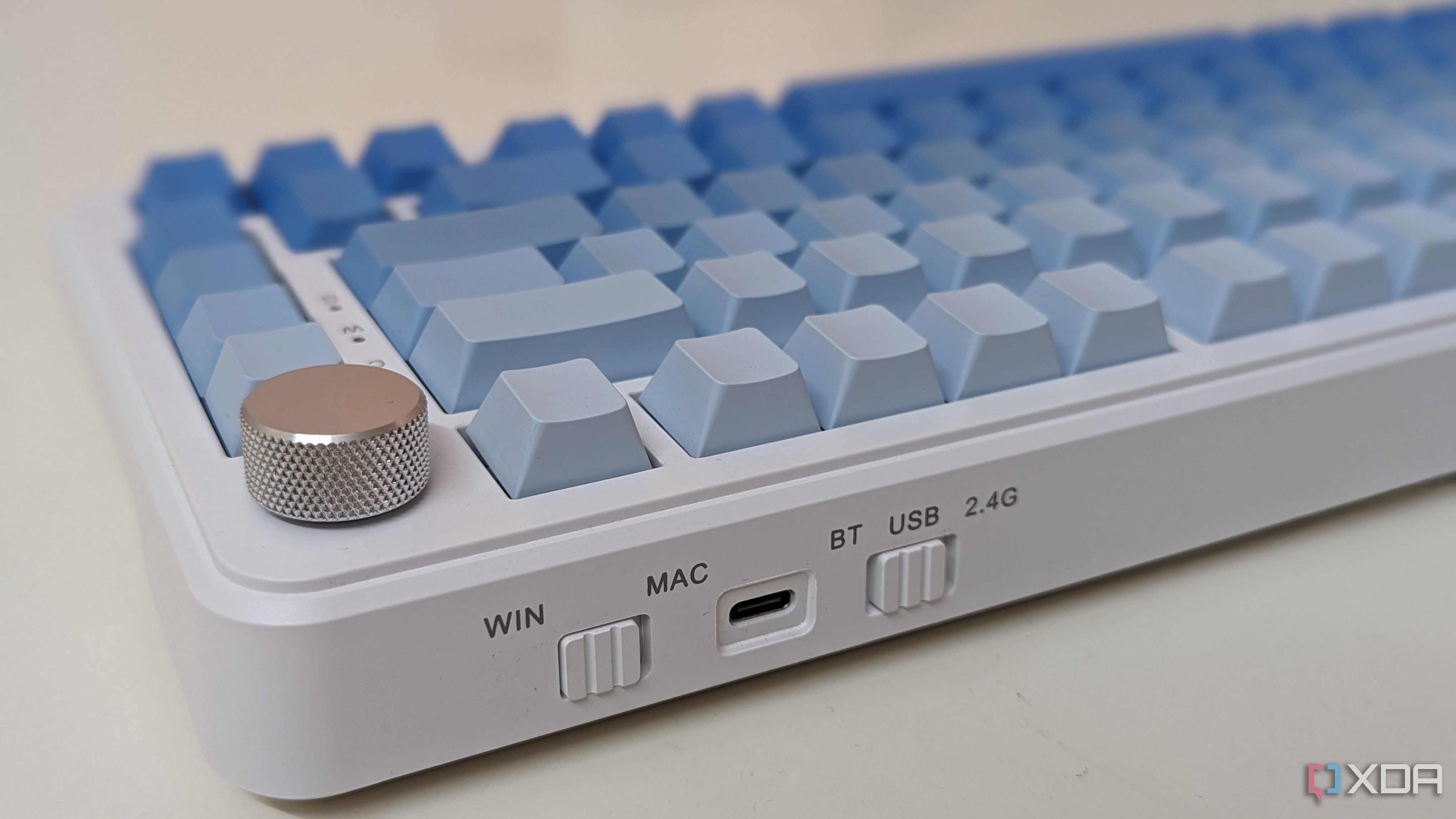 Close-up of a blue-white keyboard showing connectivity options and ports