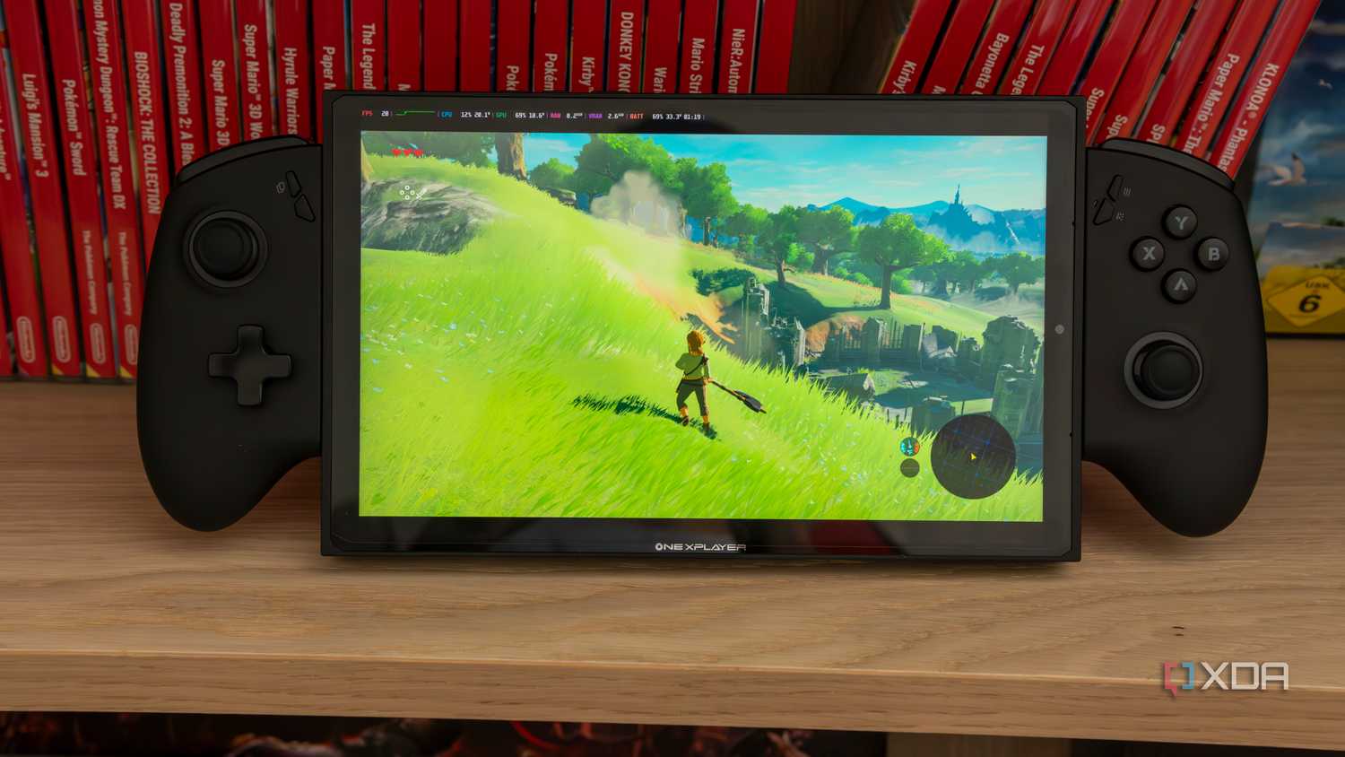 A ONEXPLAYER X1 Mini gaming handheld running The Legend of Zelda Breath of the Wild in an emulator running on Bazzite