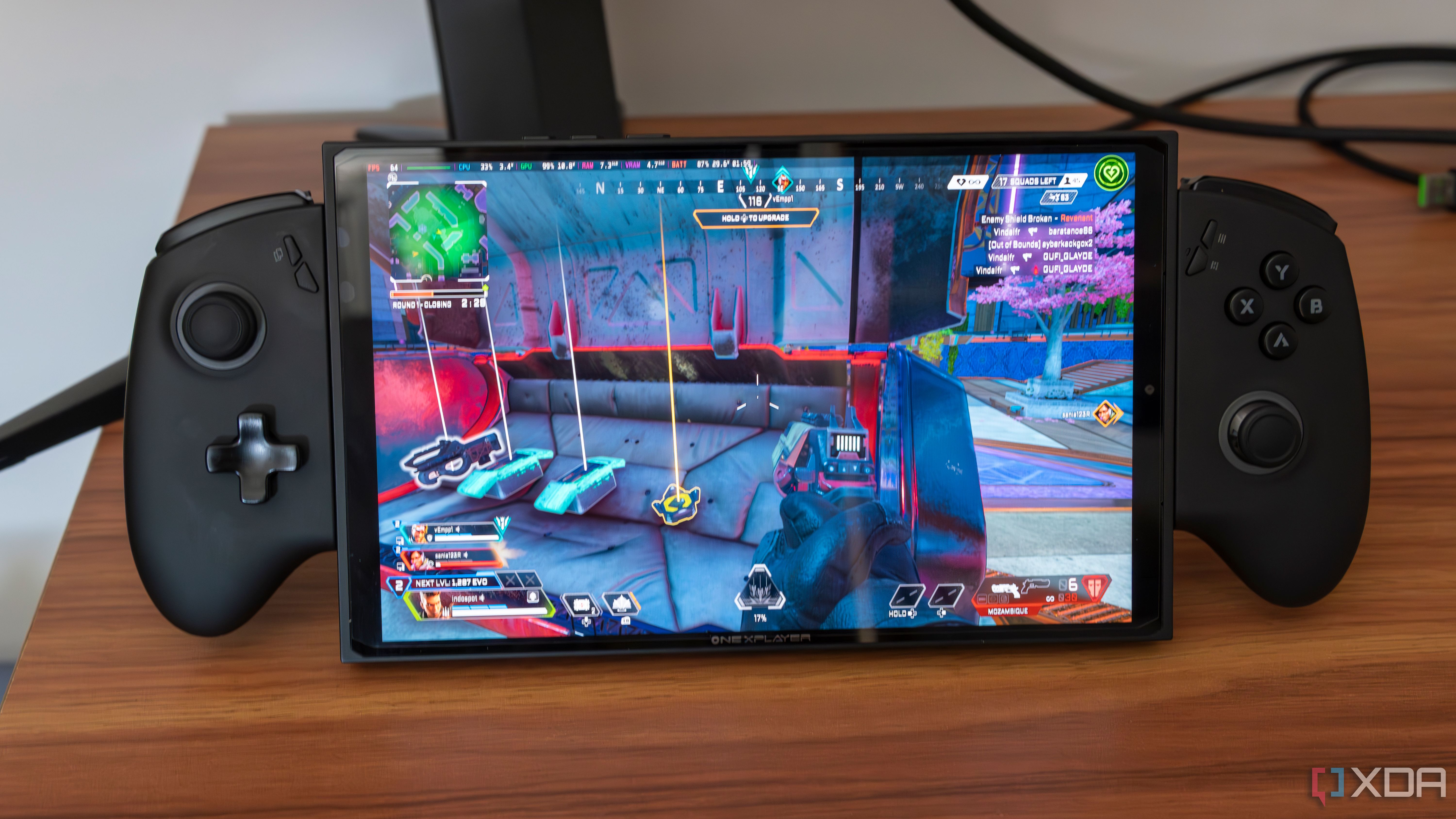 A ONEXPLAYER X1 Mini gaming handheld running Apex Legends on Bazzite