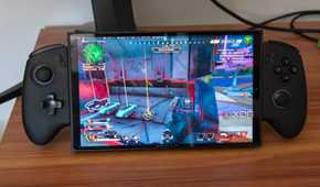 A ONEXPLAYER X1 Mini gaming handheld running Apex Legends on Bazzite