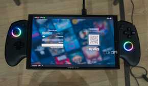 A ONEXPLAYER X1 Mini gaming handheld displaying the login screen for the Steam gaming UI upside down