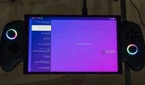 A ONEXPLAYER X1 Mini gaming handheld displaying the time zone selection screen for the Steam gaming UI upside down