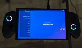 A ONEXPLAYER X1 Mini gaming handheld displaying the welcome screen for the Steam gaming UI upside down