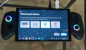A ONEXPLAYER X1 Mini gaming handheld displaying the setup process for EmuDeck, asking the user what device is being used