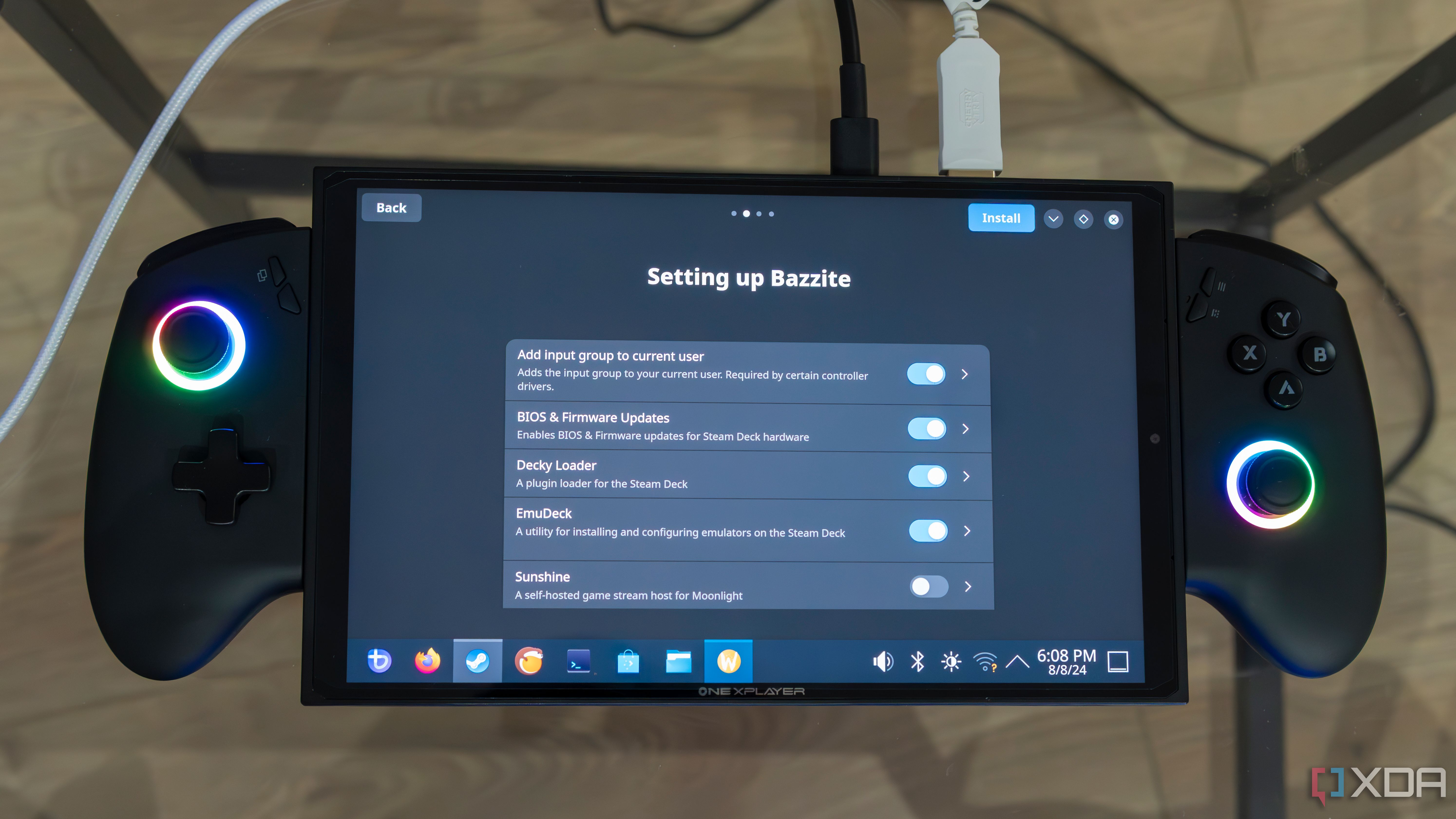 A ONEXPLAYER X1 Mini gaming handheld displaying the Bazzite setup screen with a list of things the user can choose to install