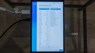 A ONEXPLAYER X1 Mini gaming handheld displaying the language selection in Bazzite