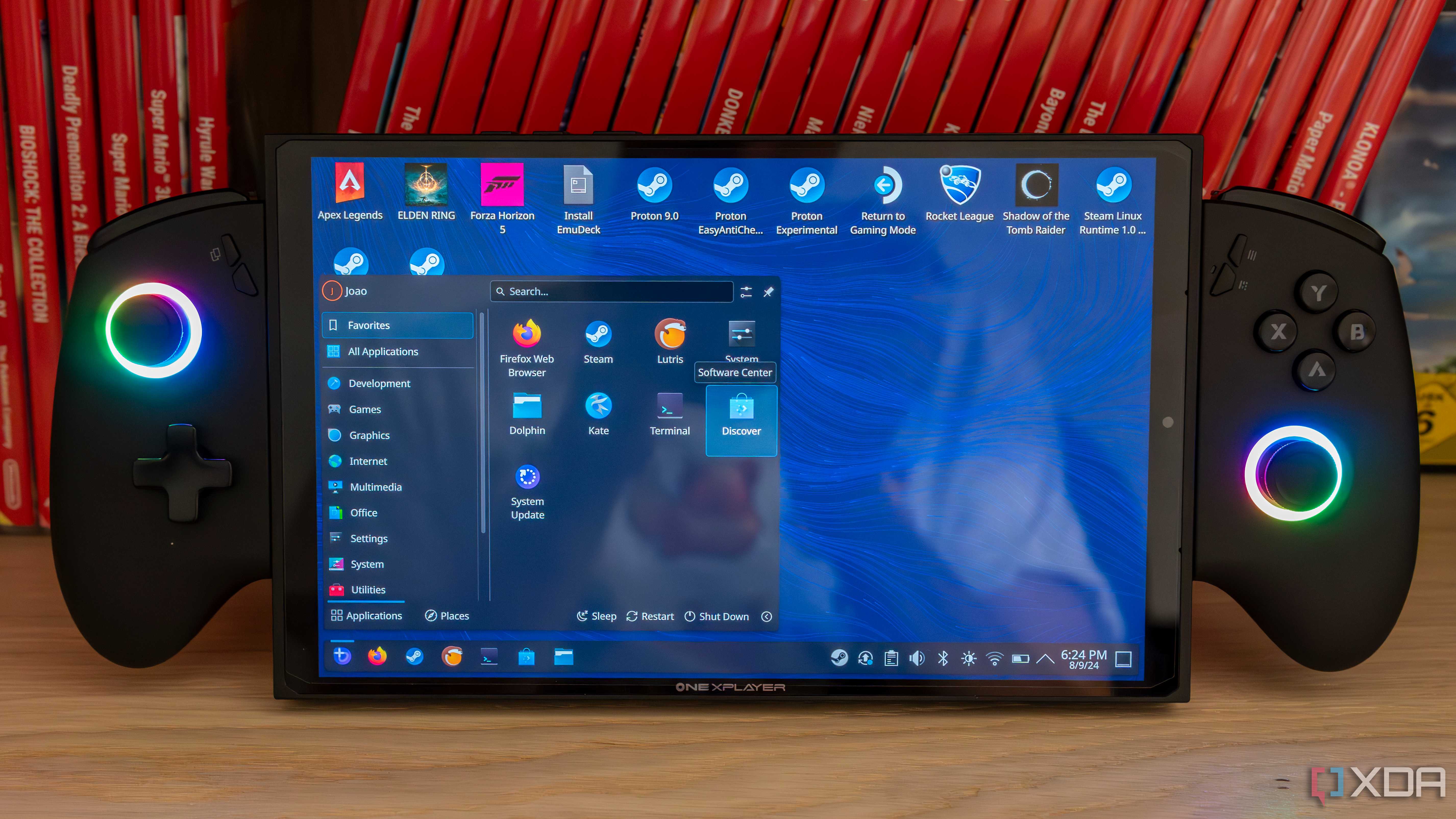 A ONEXPLAYER X1 Mini gaming handheld displaying the KDE desktop environment with the Applications menu open