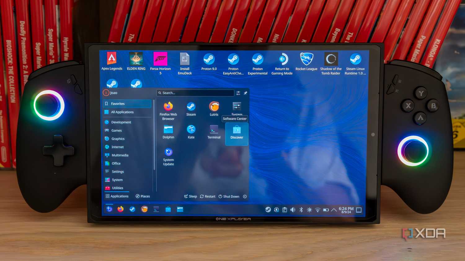A ONEXPLAYER X1 Mini gaming handheld displaying the KDE desktop environment with the Applications menu open