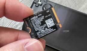 crucial p310 ssd held in fingers