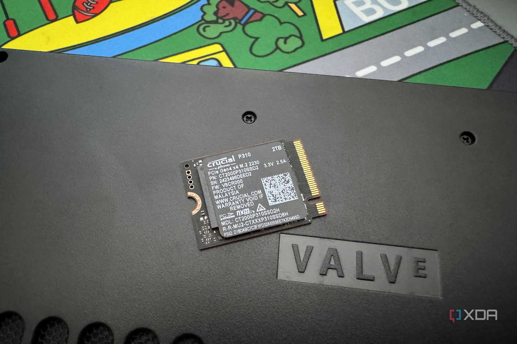 crucial p310 ssd on steam deck next to word valve