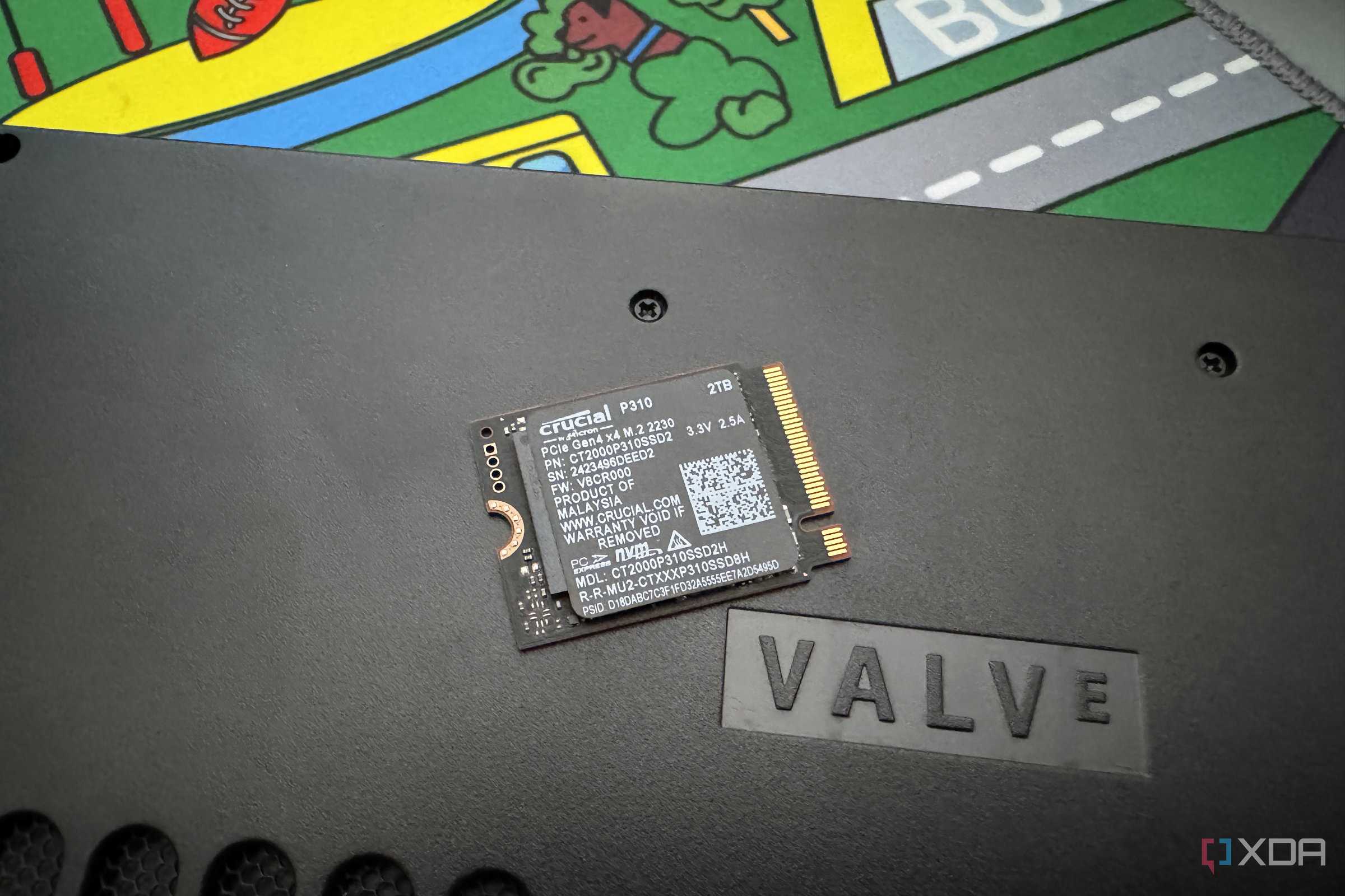 crucial p310 ssd on steam deck next to word valve