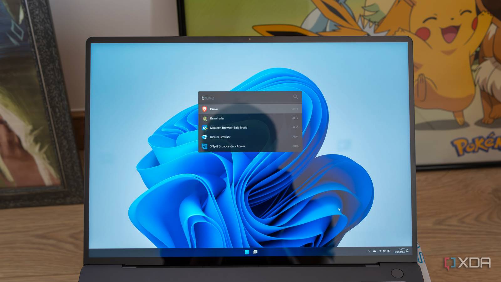 A Windows 11 laptop running Flow Launcher with search results for Br