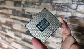 A person holding a server-grade Intel Xeon E5-2650 v4 processor