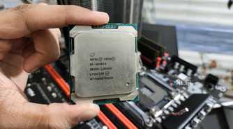 A person holding a server-grade Intel Xeon E5-2650 v4 processor
