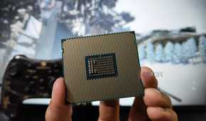 A person holding a server-grade Intel Xeon E5-2650 v4 processor