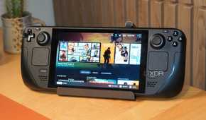 The Jsaux Steam Deck dock holding a Steam Deck with the screen on.