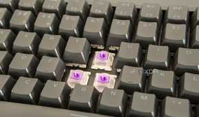 Close-up view of the Keychron K2 HE with three switches exposed and RGB lighting off