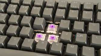 Close-up view of the Keychron K2 HE with three switches exposed and RGB lighting off