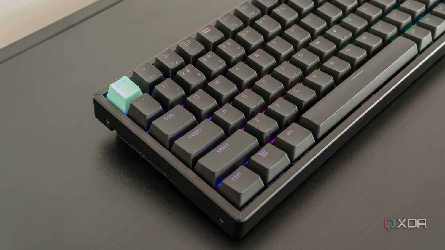 Angled close-up view of the left side of the Keychron K2 HE with RGB lighting enabled