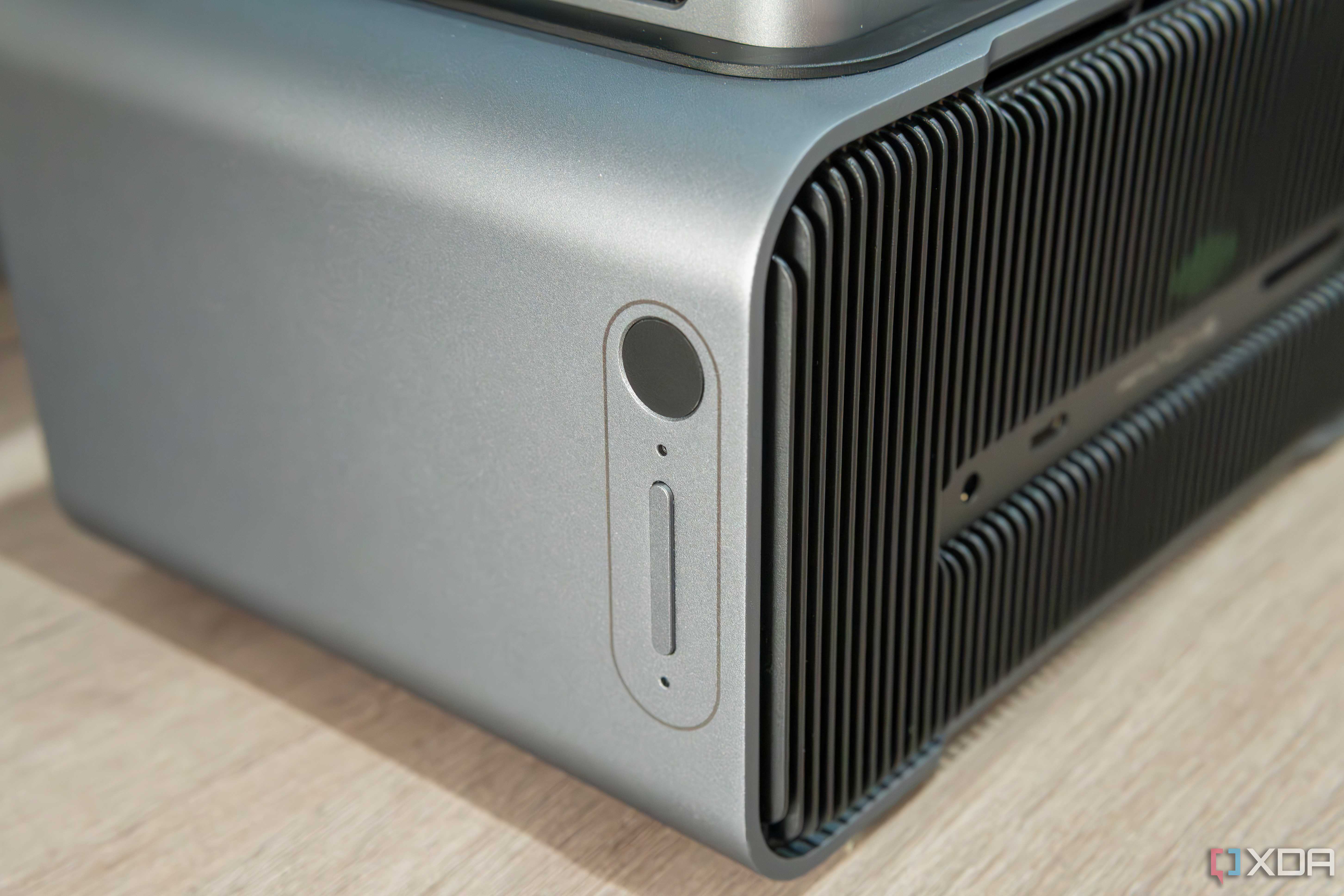 Close-up view of the fingerprint reader and volume rocker on the Khadas Mind Graphics