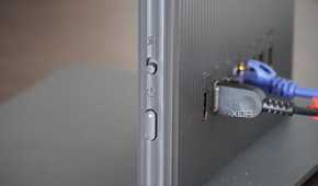 The power switch on the side of the Lenovo AIO.