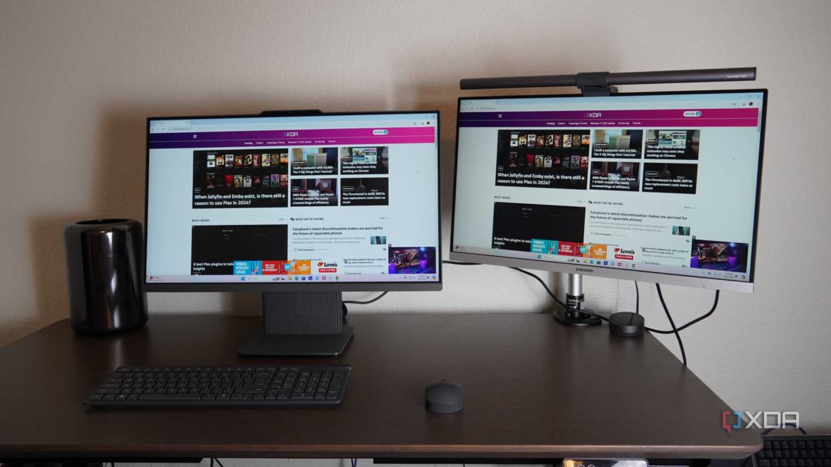 A dual-display setup with the Lenovo AIO at the center.