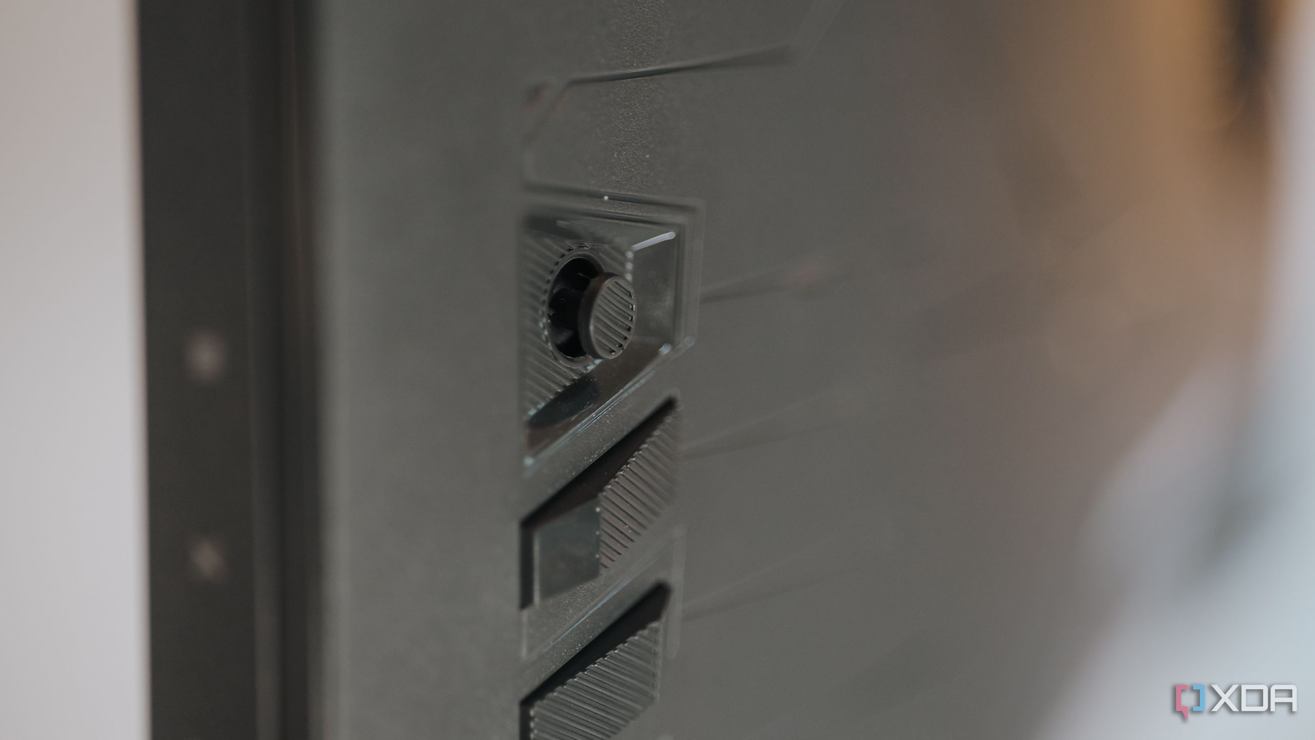 Close up of joystick control on Asus ROG Strix XG27UCS gaming monitor