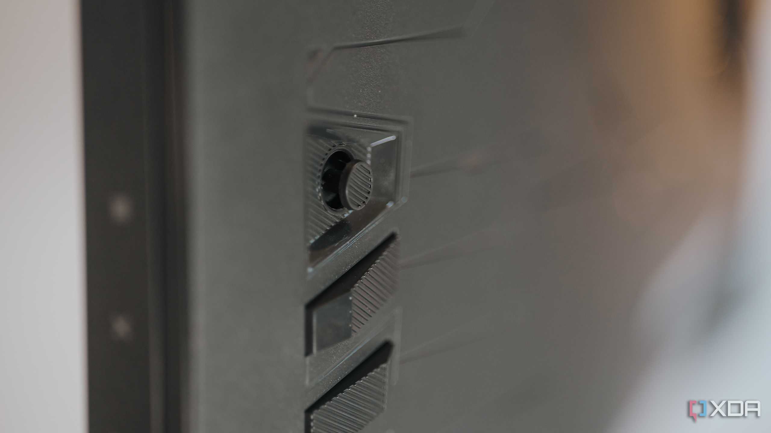 Close up of joystick control on Asus ROG Strix XG27UCS gaming monitor