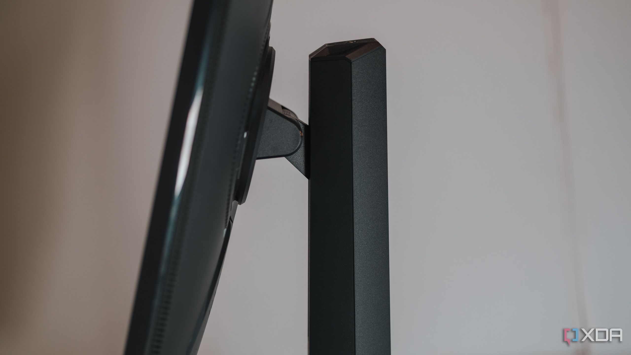 Side view showing tilt mechanism on Asus ROG Strix XG27UCS gaming monitor