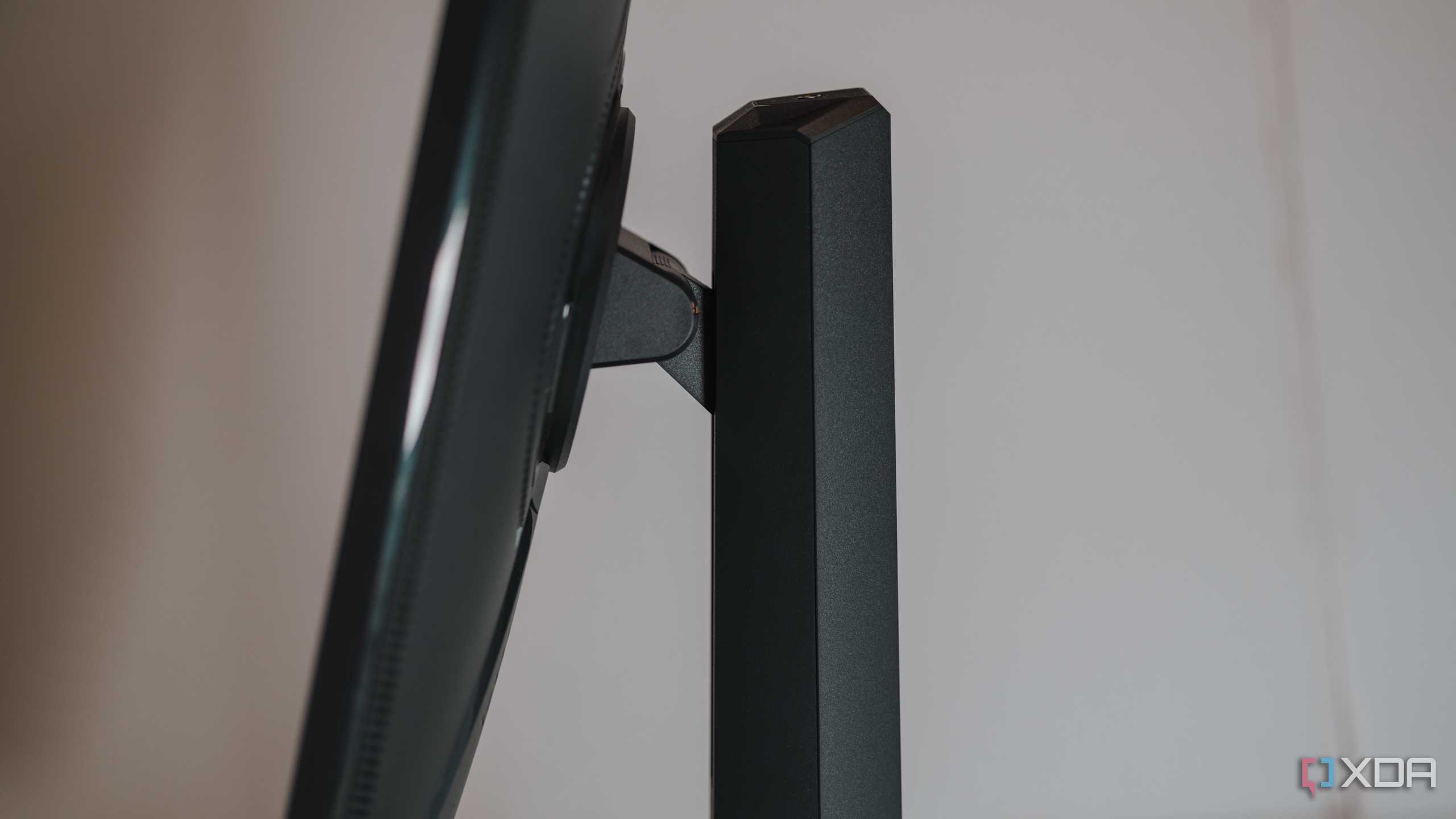 Side view showing tilt mechanism on Asus ROG Strix XG27UCS gaming monitor