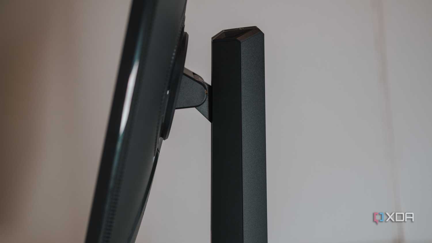 Side view showing tilt mechanism on Asus ROG Strix XG27UCS gaming monitor