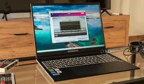Angled view of a Maingear ML-16 2024 laptop on a glass table