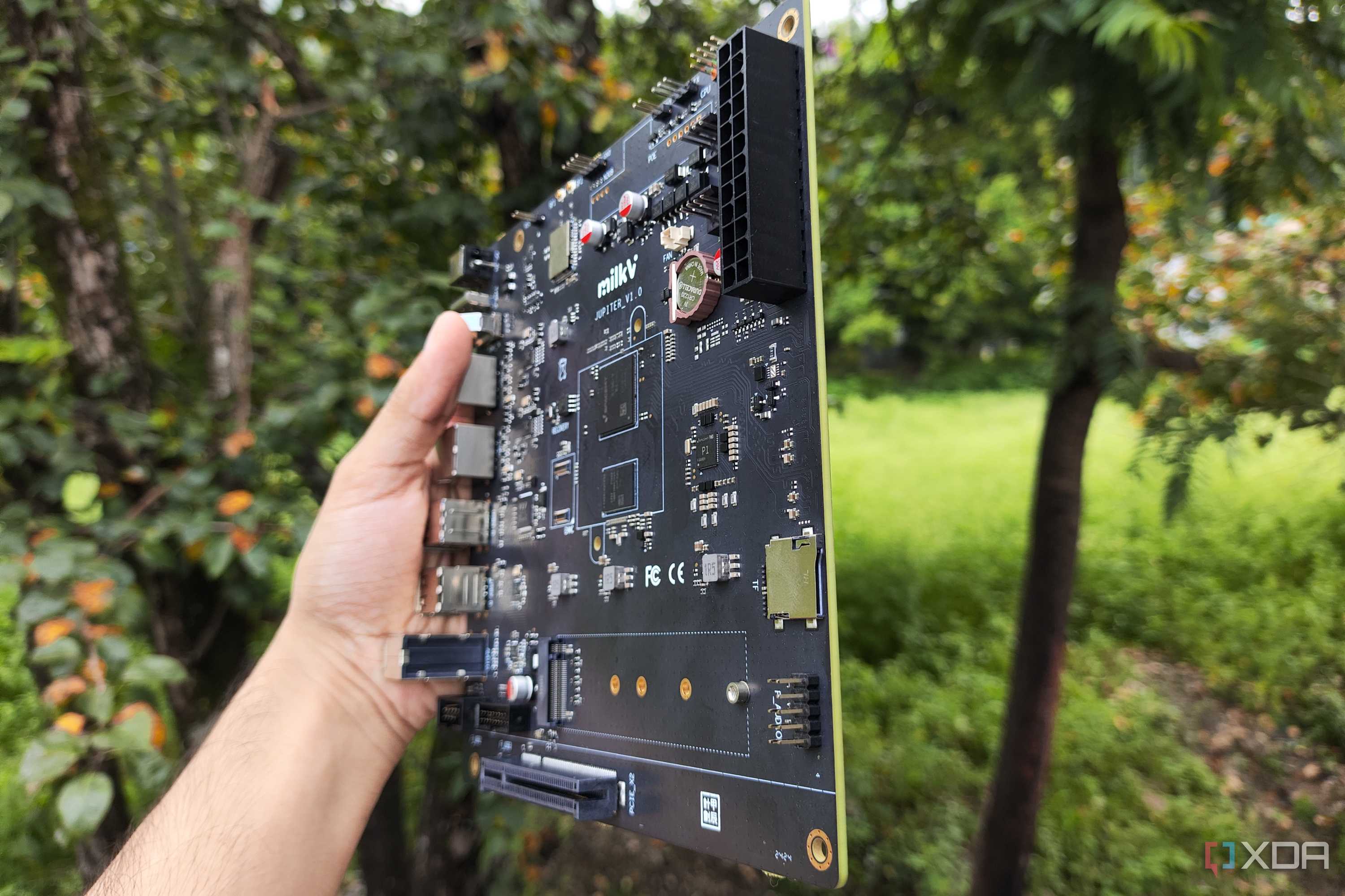 The K1 version of the Milk-V Jupiter mini-ITX motherboard with a PCIe 3.0 SSD lying nearby