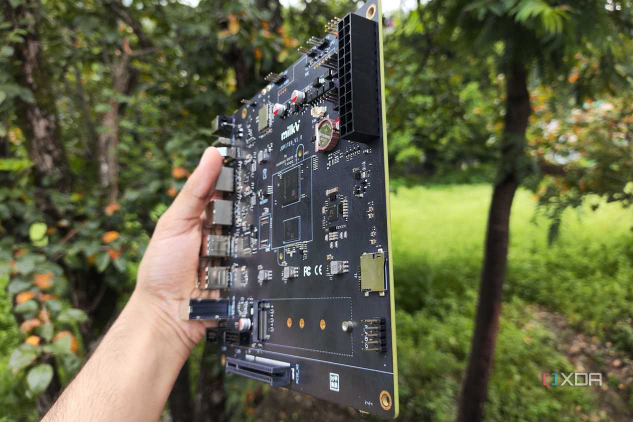 The K1 version of the Milk-V Jupiter mini-ITX motherboard with a PCIe 3.0 SSD lying nearby