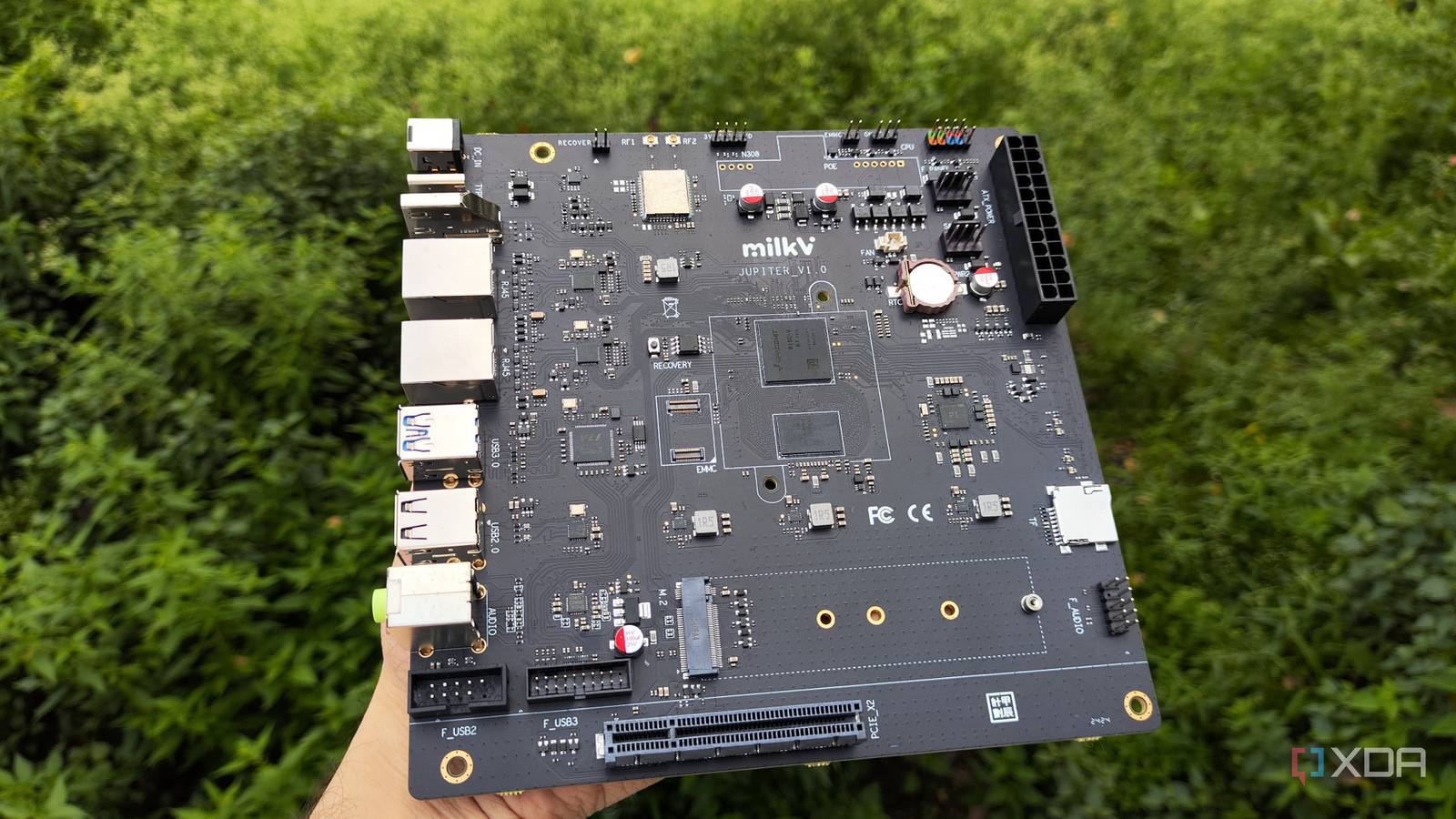 The K1 version of the Milk-V Jupiter mini-ITX motherboard with a PCIe 3.0 SSD lying nearby