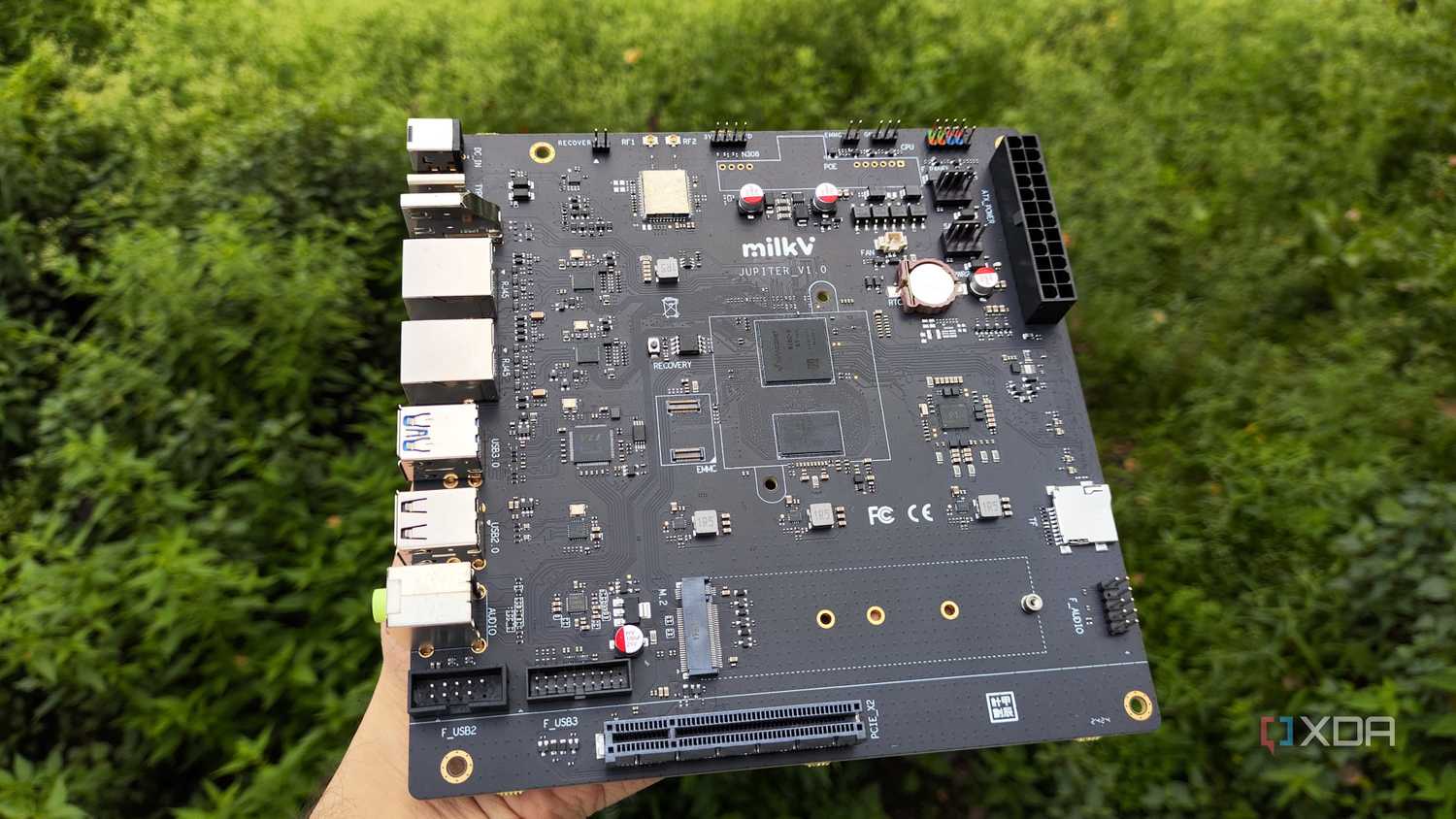 The K1 version of the Milk-V Jupiter mini-ITX motherboard with a PCIe 3.0 SSD lying nearby