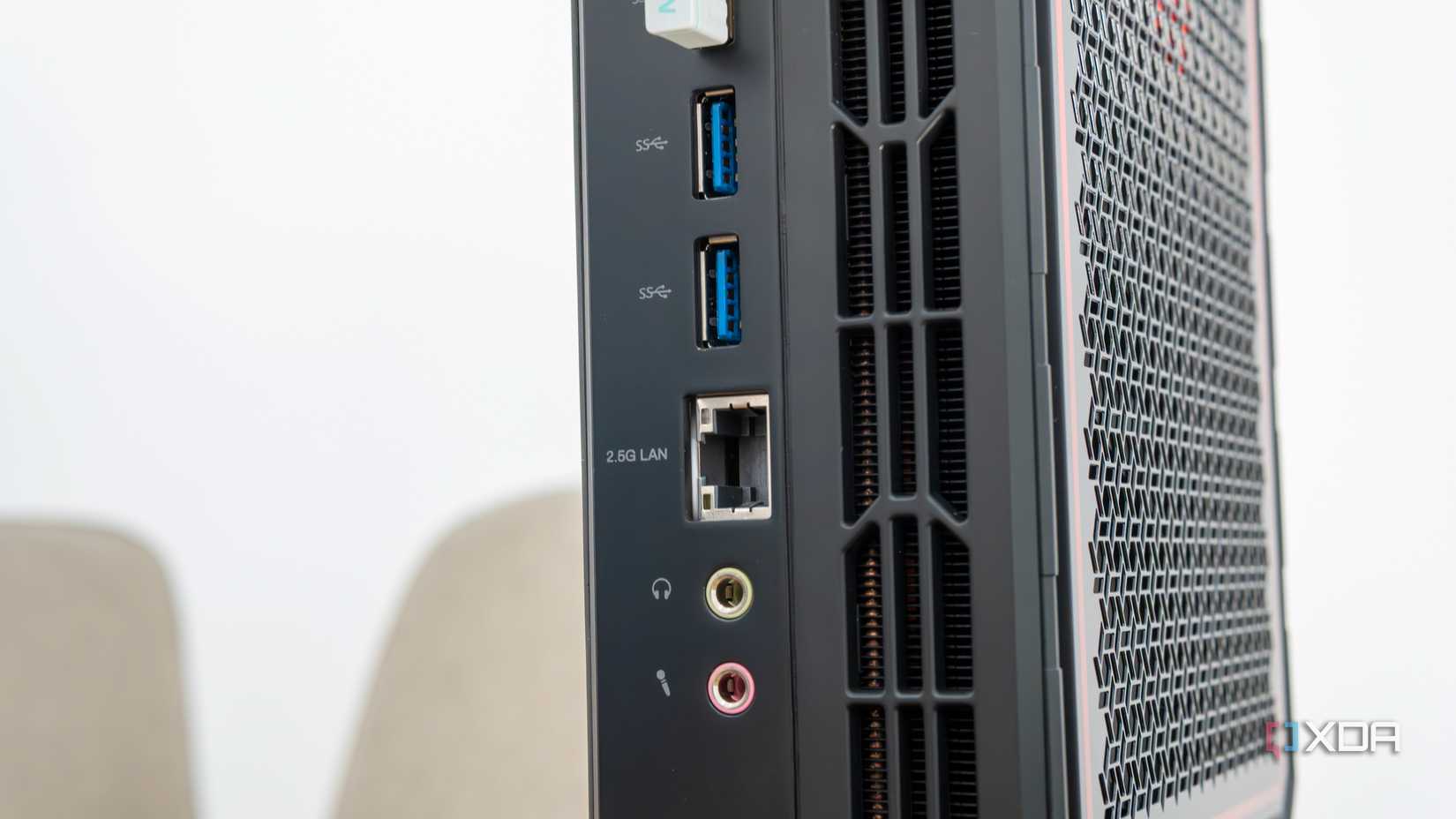 Close-up view of the USB, Ethernet, and audio ports on the back of the Minisforum AtomMan G7 Pt