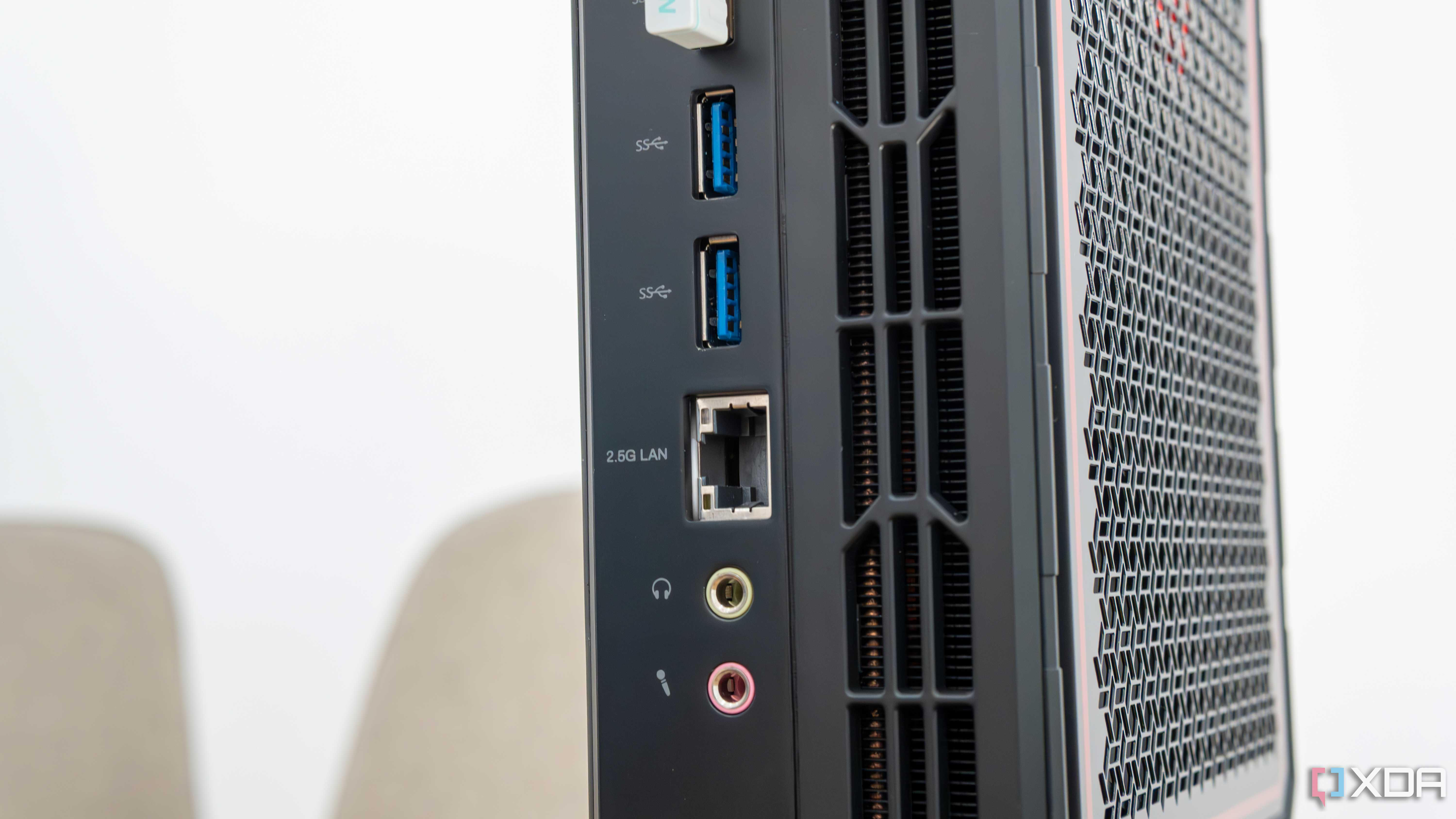 Close-up view of the USB, Ethernet, and audio ports on the back of the Minisforum AtomMan G7 Pt