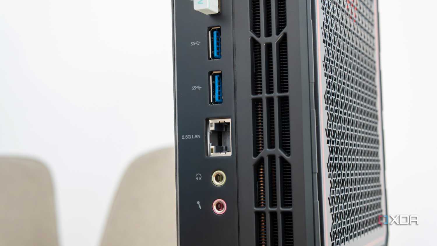 Close-up view of the USB, Ethernet, and audio ports on the back of the Minisforum AtomMan G7 Pt