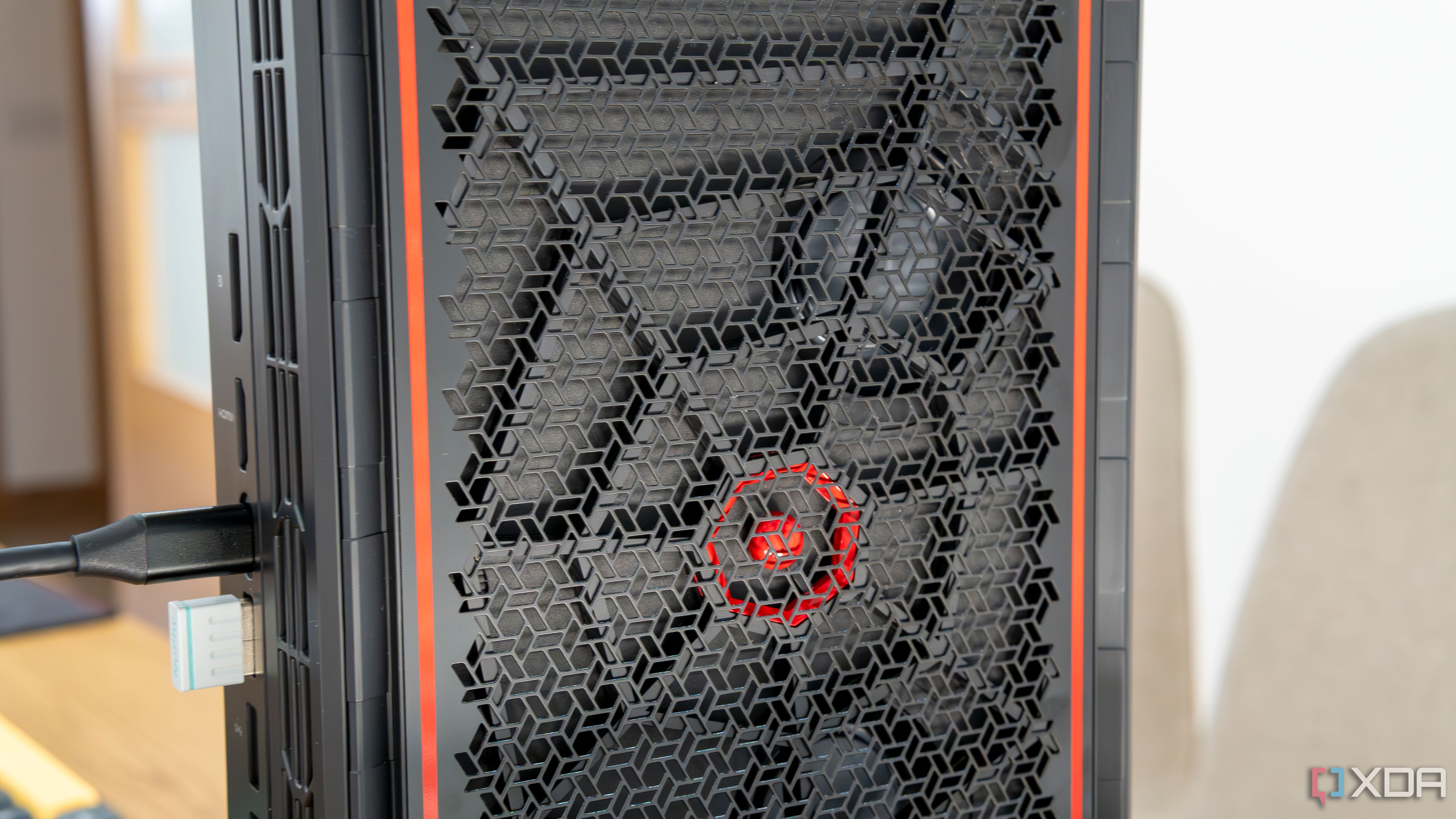 Close-up view of the side intake vent on the Minisforum AtomMan G7 Pt