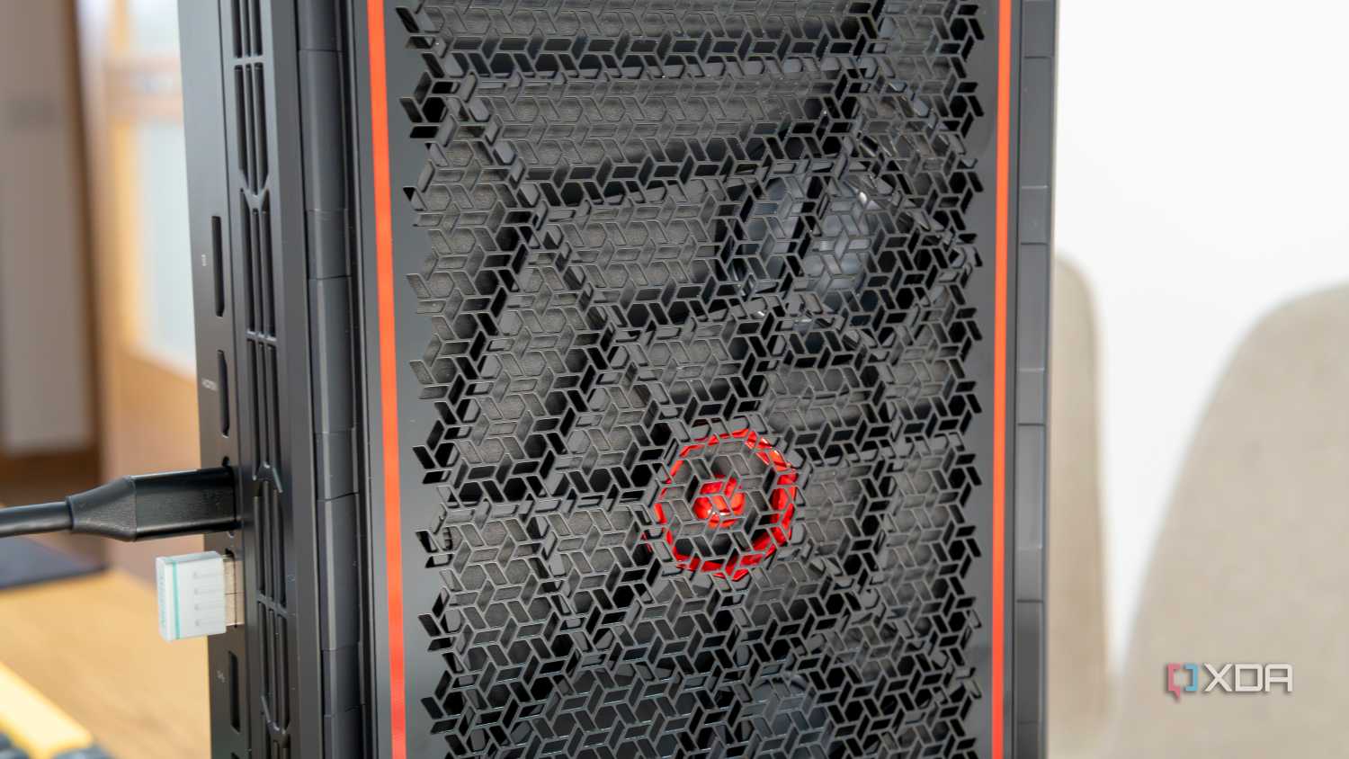 Close-up view of the side intake vent on the Minisforum AtomMan G7 Pt