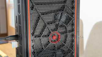Close-up view of the side intake vent on the Minisforum AtomMan G7 Pt