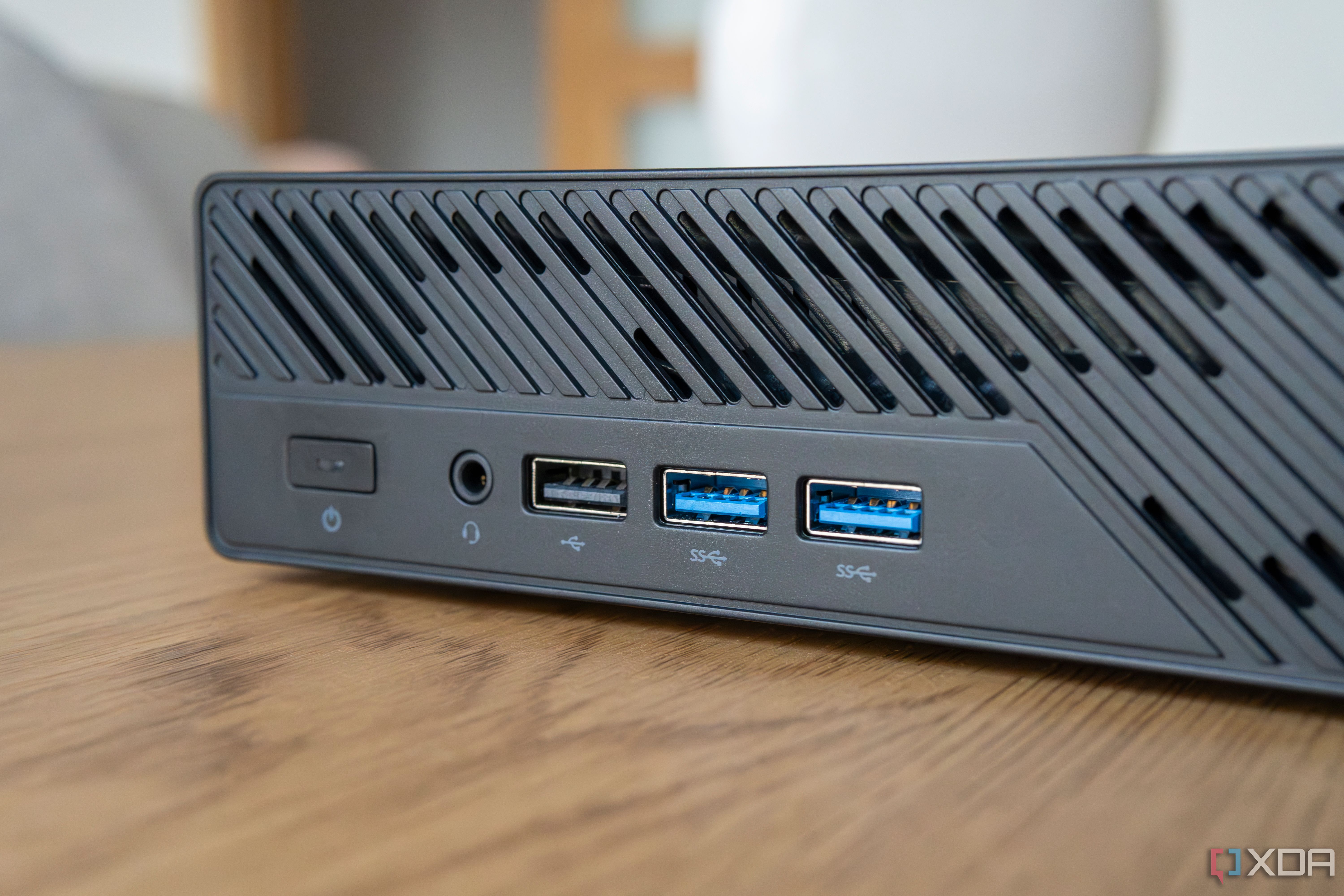 Close-up view of the USB ports on the front of the Minisforum MS-A1