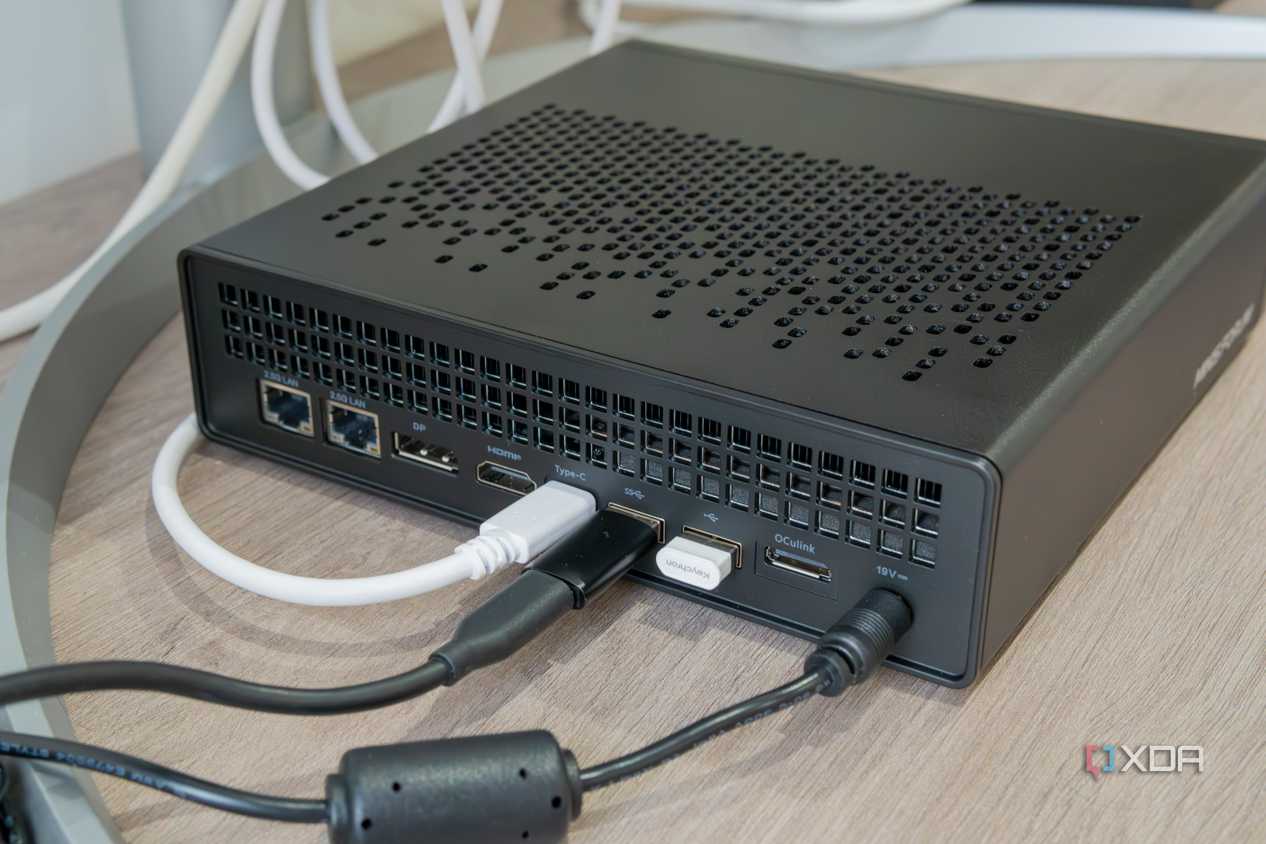Angled rear of the Minisforum with multiple peripherals plugged in