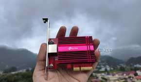 A person holding a TP-Link 10G NIC