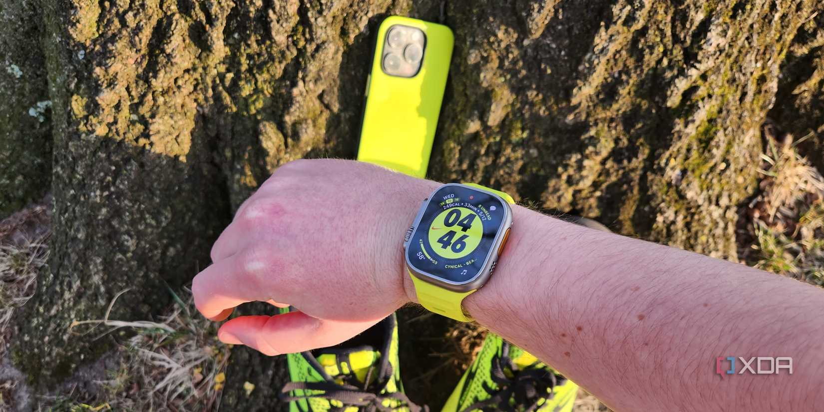 Nomad High Volta with a phone and Apple Watch band.