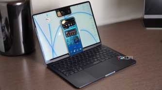 Dynamic Island on an iPhone 15 Pro Max resting on an M2 MacBook Air with NotchNook.