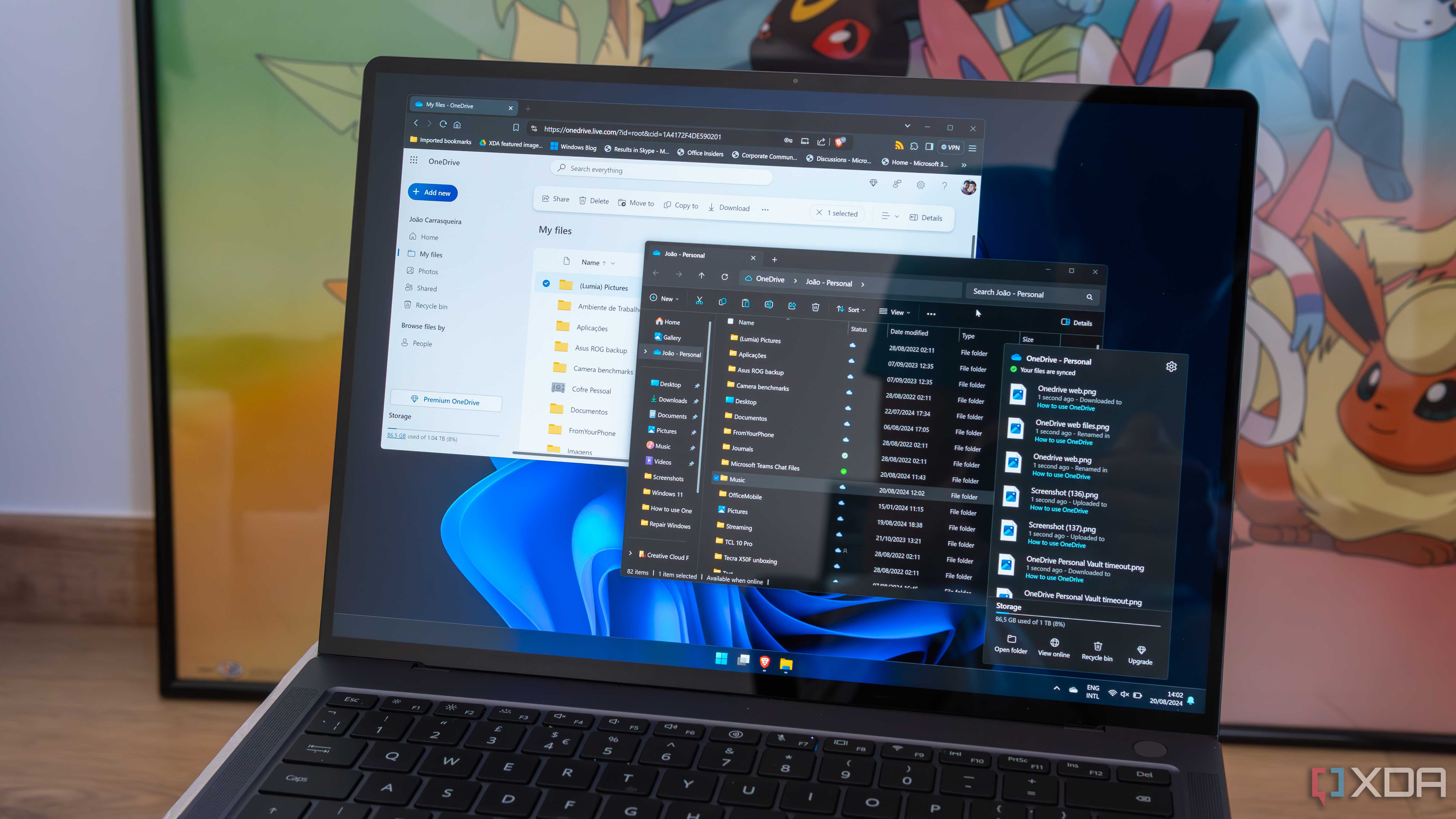 A Windows 11 laptop showing various interfaces for OneDrive