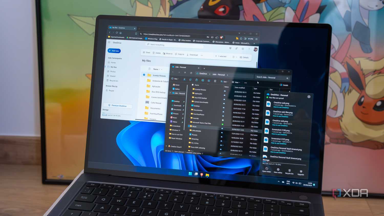 A Windows 11 laptop showing various interfaces for OneDrive