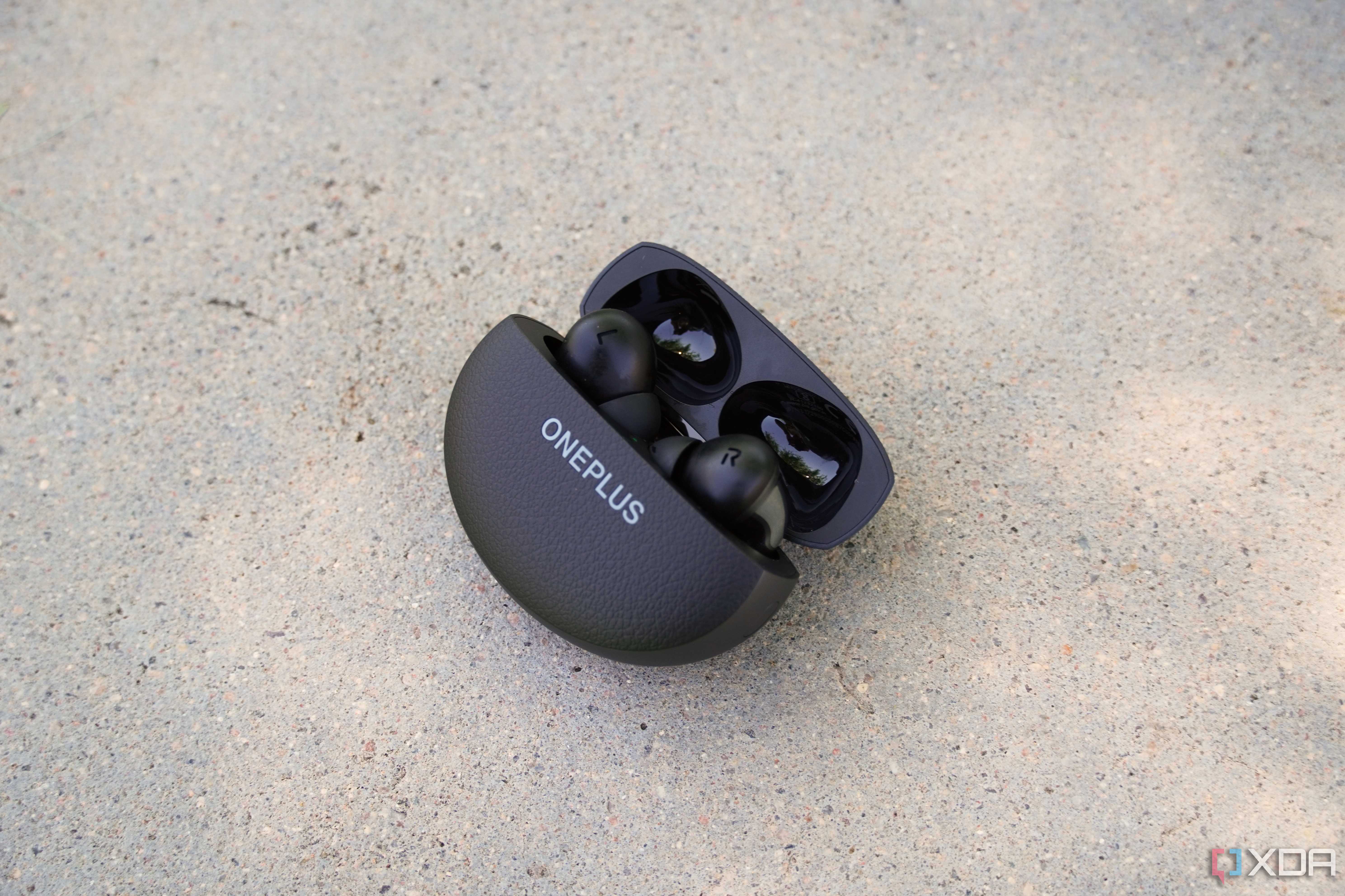 OnePlus Buds Pro 3 in their case half opened.